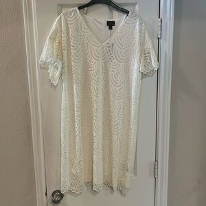 White stretch lace V-neck sheath dress.